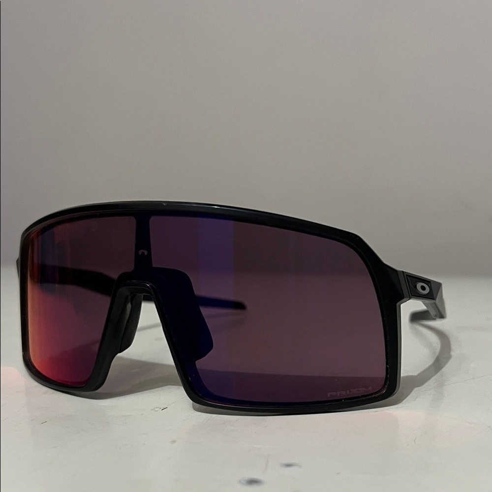Oakley Black Frame Sunglasses with Red-Tinted Lenses